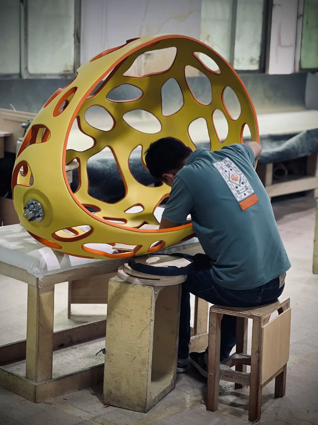 Worker assembling sofa frame in Dongguan furniture factory workshop